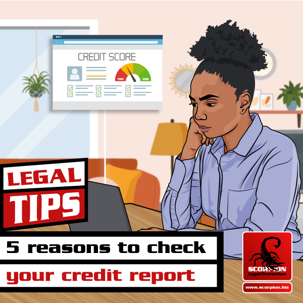 Woman sitting at desk checking her credit score online